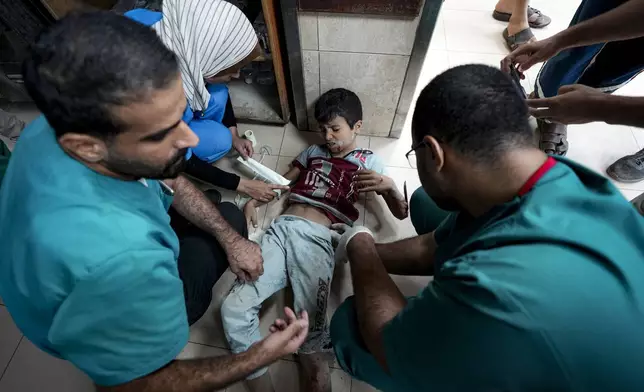 A Palestinian child wounded in the Israeli bombardment of the Gaza Strip is treated in a hospital in Deir al-Balah, Monday, Sept. 30, 2024. (AP Photo/Abdel Kareem Hana)