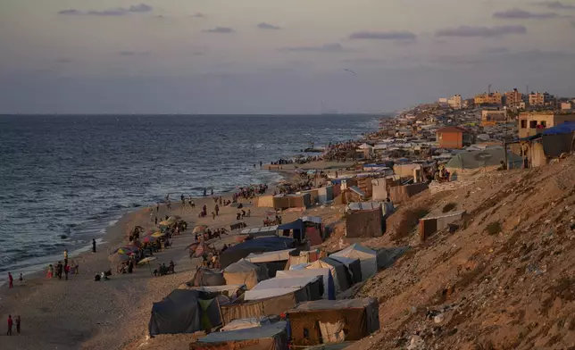 Tents are crammed together as displaced Palestinians camp along the beach of Deir al-Balah, central Gaza Strip, Wednesday, Oct. 9, 2024. (AP Photo/Abdel Kareem Hana)