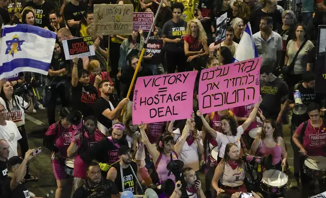 People protest against Prime Minister Benjamin Netanyahu's government and call for the release of hostages held in the Gaza Strip by the Hamas militant group, in Tel Aviv, Israel, Saturday, Oct. 19, 2024. (AP Photo/Mahmoud Illean)