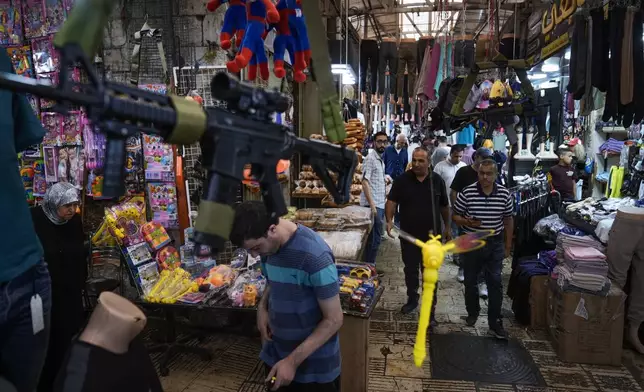 Palestinians shop at the commercial center of the old town, in the West Bank city of Nablus Sunday, Sept. 15, 2024. (AP Photo/Majdi Mohammed)