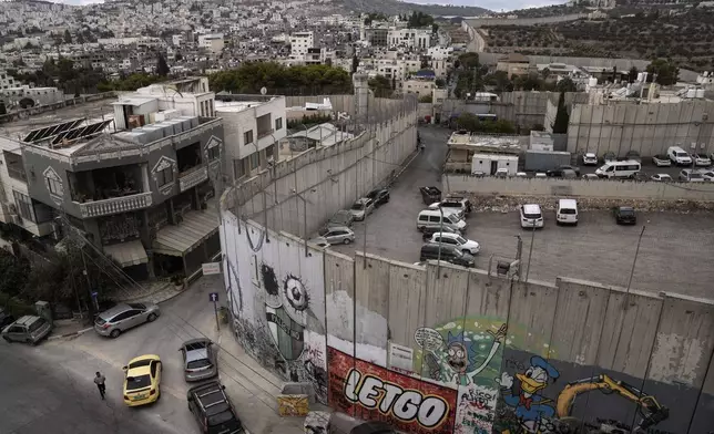 A view of a section of the separation wall in the West Bank city of Bethlehem Tuesday, Sept. 17, 2024. (AP Photo/Mahmoud Illean)