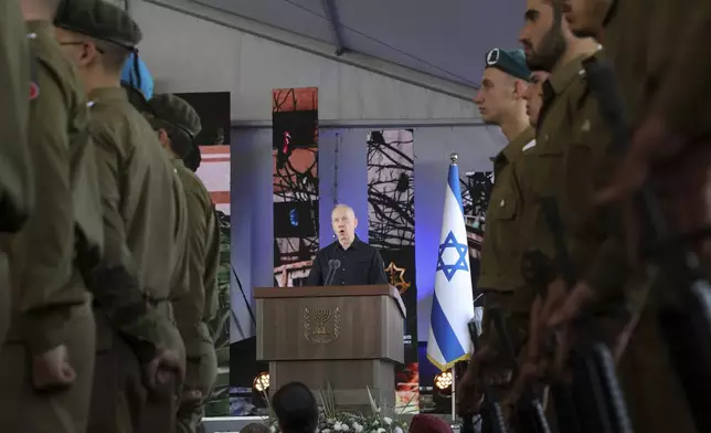 Israel's Defense Minister Yoav Gallant speaks during a ceremony marking the Hebrew calendar anniversary of the Hamas attack on October 7 last year that sparked the ongoing war in Gaza, at the Mount Herzl military cemetery in Jerusalem, Israel Sunday Oct. 27, 2024. (Gil Cohen-Magen/Pool Photo via AP)