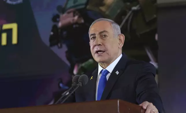 Israel's Prime Minister Benjamin Netanyahu speaks during a ceremony marking the Hebrew calendar anniversary of the Hamas attack on October 7 last year that sparked the ongoing war in Gaza, at the Mount Herzl military cemetery in Jerusalem, Israel Sunday Oct. 27, 2024. (Gil Cohen-Magen/Pool Photo via AP)