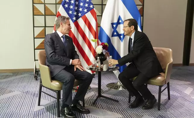 U.S. Secretary of State Antony Blinken, left, meets with Israel's President Isaac Herzog in Tel Aviv, Tuesday, Oct. 22, 2024. (Nathan Howard/Pool via AP)