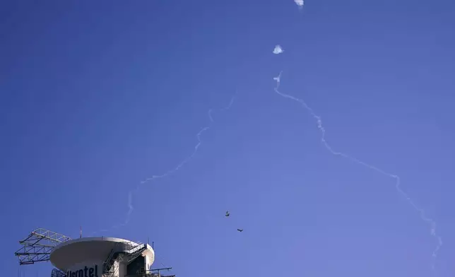 Israel's Iron Dome anti-missile system fires to intercept as air raid sirens sound in Tel Aviv, Wednesday, Oct. 23, 2024. (Nathan Howard/Pool Photo via AP)