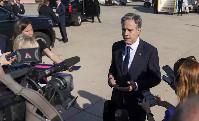 U.S. Secretary of State Antony Blinken speaks with members of the media at Ben Gurion International Airport before departing for Riyadh, Saudi Arabia, in Tel Aviv, Israel Wednesday, Oct. 23, 2024. (Nathan Howard/Pool Photo via AP)