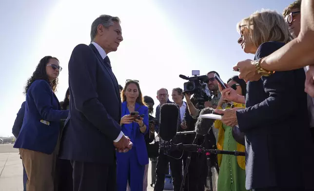 U.S. Secretary of State Antony Blinken speaks with members of the media as he arrives at Ben Gurion International Airport before departing for Riyadh, Saudi Arabia, in Tel Aviv, Israel, Wednesday, Oct. 23, 2024. (Nathan Howard/Pool Photo via AP)