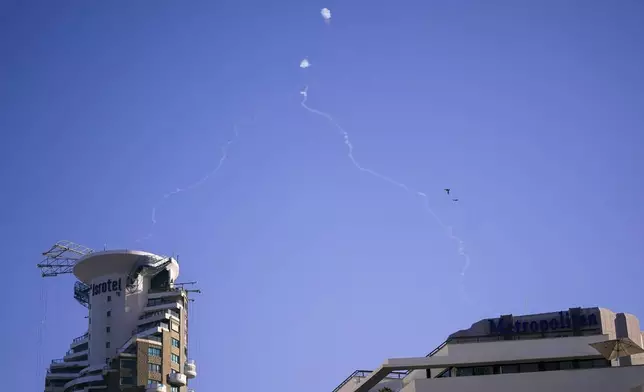 Israel's Iron Dome anti-missile system fires to intercept as air raid sirens sound in Tel Aviv, Wednesday, Oct. 23, 2024. (Nathan Howard/Pool Photo via AP)