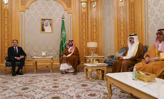 U.S. Secretary of State Antony Blinken, left, meets Saudi Crown Prince Mohammed bin Salman in Riyadh, Saudi Arabia, Wednesday Oct. 23, 2024. (Nathan Howard/Pool via AP)