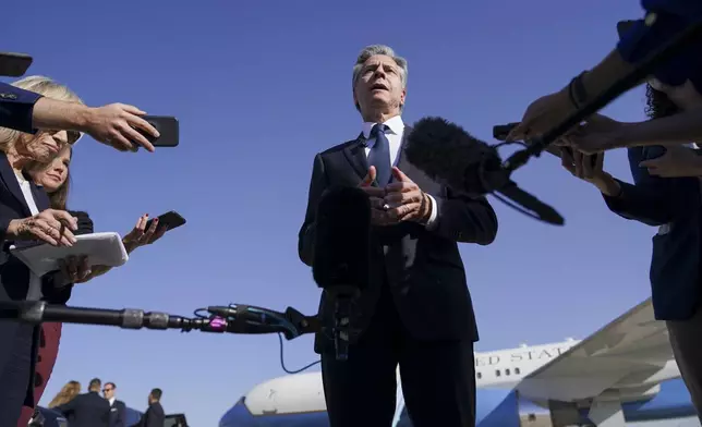 U.S. Secretary of State Antony Blinken speaks with members of the media as he arrives at Ben Gurion International Airport before departing for Riyadh, Saudi Arabia, in Tel Aviv, Israel, Wednesday, Oct. 23, 2024. (Nathan Howard/Pool Photo via AP)