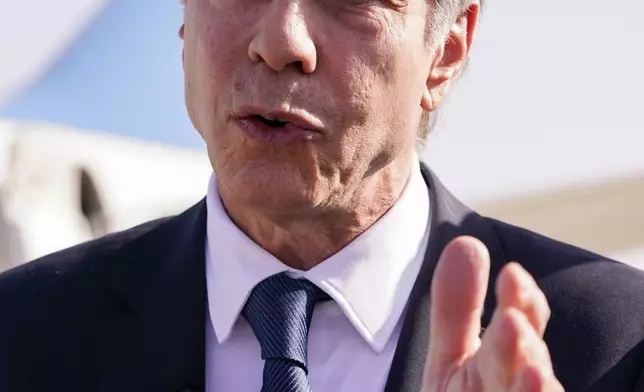 U.S. Secretary of State Antony Blinken speaks with members of the media as he arrives at Ben Gurion International Airport before departing for Riyadh, Saudi Arabia, in Tel Aviv, Israel, Wednesday, Oct. 23, 2024. (Nathan Howard/Pool Photo via AP)