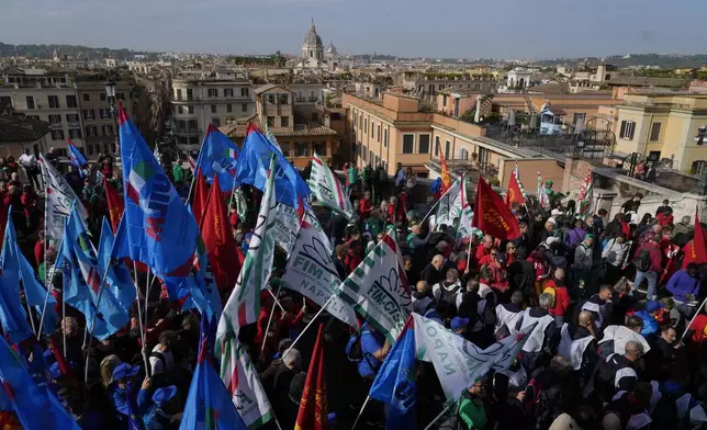 Workers of automotive sector march during a demonstration in Rome on the occasion of their national strike, Friday, Oct. 18, 2024. (AP Photo/Gregorio Borgia)