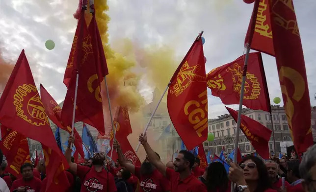 Workers of automotive sector march during a demonstration in Rome on the occasion of their national strike, Friday, Oct. 18, 2024. (AP Photo/Gregorio Borgia)