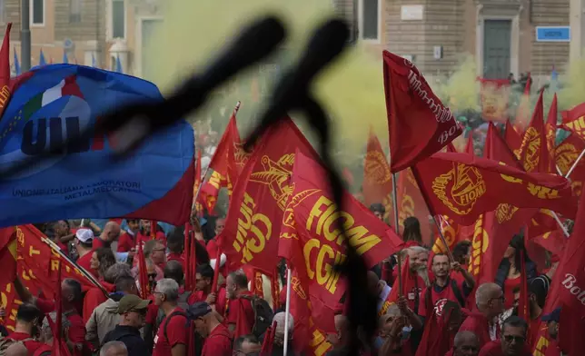 Workers of automotive sector gather in Rome's Piazza del Popolo Square during a demonstration on the occasion of their national strike, Friday, Oct. 18, 2024. (AP Photo/Gregorio Borgia)