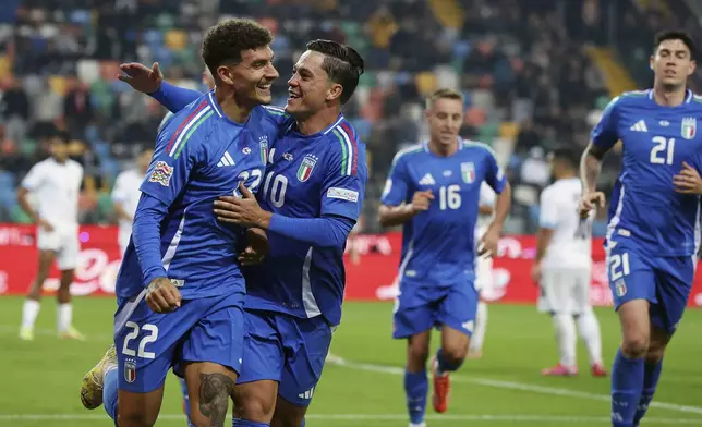 Italian's Giovanni di Lorenzo celebrates after scoring his side's second goal during the UEFA Nations League soccer match between Italia and Israel at the Bluenergy Stadium in Udine, Italy, Monday, Oct. 14, 2024. (Andrea Bressanutti/LaPresse via AP)