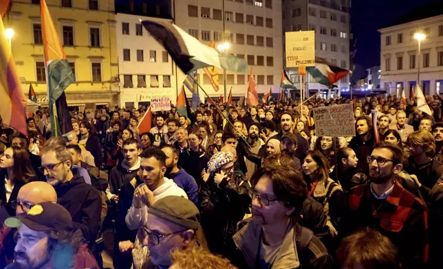 People march during a pro-Palestinians protest ahead of the Nations League soccer match between Italy and Israel, in Udine, Italy, Monday, Oct. 14, 2024. (Riccardo Modena/LaPresse via AP)