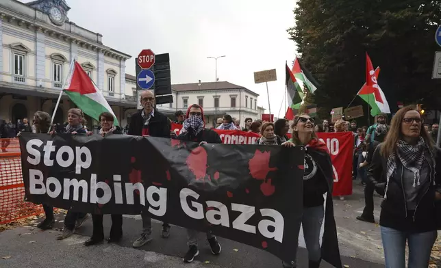 People take part in a pro-Palestinians protest ahead of the Nations League soccer match between Italy and Israel, in Udine, Italy, Monday, Oct. 14, 2024. (Riccardo Modena/LaPresse via AP)