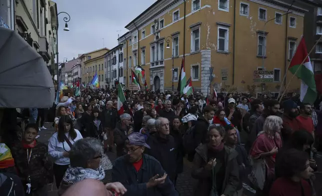 People march during a pro-Palestinians protest ahead of the Nations League soccer match between Italy and Israel, in Udine, Italy, Monday, Oct. 14, 2024. (Riccardo Modena/LaPresse via AP)