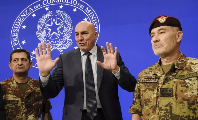 Italian Defense Minister Guido Crosetto, center, General Francesco Paolo Figliuolo, left, and General Giovanni Maria Iannucci meet the media during a press conference about the U.N. peacekeeping force in Lebanon, in Rome Thursday Oct. 10 2024. (Mauro Scrobogna/LaPresse via AP)