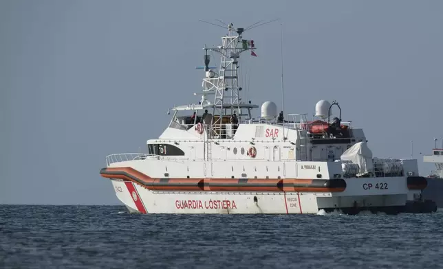 FILE - An Italian coast guard vessel leaves the port of Shengjin, Albania, to Italy carrying 12 of 16 migrants intercepted in international waters and sent to the two reception facilities in Albania earlier this week after a court in Rome rejected their detention, on Saturday, Oct, 19, 2024. (AP Photo/Vlasov Sulaj, File)