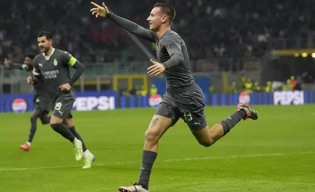 AC Milan's Francesco Camarda celebrates after scoring a goal that was later disallowed, during the Champions League opening phase soccer match between AC Milan and Club Brugge at the San Siro stadium in Milan, Italy, Tuesday, Oct. 22, 2024. (AP Photo/Antonio Calanni)