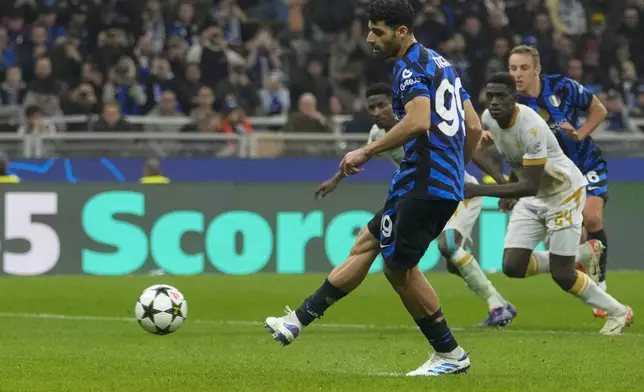 Inter Milan's Mehdi Taremi scores his side's fourth goal from penalty spot during the Champions League opening phase soccer match between Inter Milan and Red Star, at the San Siro stadium in Milan, Italy, Tuesday, Oct. 1, 2024. (AP Photo/Luca Bruno)