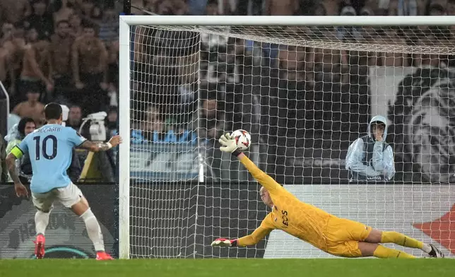 Lazio's Mattia Zaccagni, left, scores from penalty the fourth goal against Nice during an Europa League opening phase soccer match between Lazio and Nice, at Rome's Olympic Stadium, Thursday, Oct. 3, 2024. (AP Photo/Andrew Medichini)