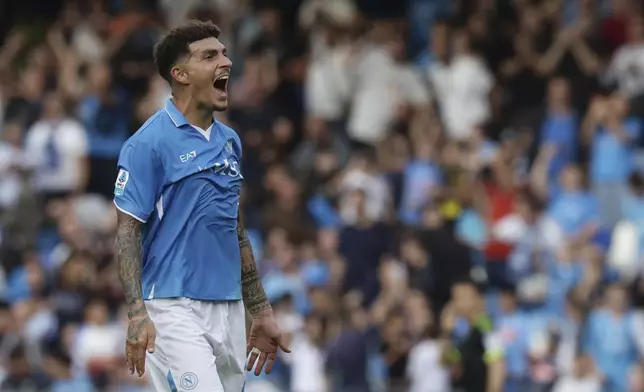 Napoli's Giovanni Di Lorenzo celebrates after scoring the opening goal during the Serie A soccer match between Napoli and Lecce at the Diego Armando Maradona Stadium in Naples, Italy, Saturday, Oct. 26, 2024. (Alessandro Garofalo/LaPresse via AP)