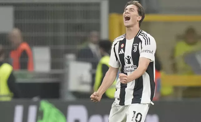 Juventus' Kenan Yildiz celebrates after scoring his side's third goal during a Serie A soccer match between Inter Milan and Juventus at the San Siro stadium in Milan, Italy, Sunday, Oct. 27, 2024. (AP Photo/Luca Bruno)