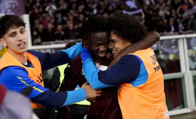 Torino's Njie celebrates after scoring their side's first goal of the game during the Serie A soccer match between Torino FC and Como at the Stadio Olimpico Grande Torino in Turin, Italy,Oct. 25, 2024. (Fabio Ferrari/LaPresse via AP)