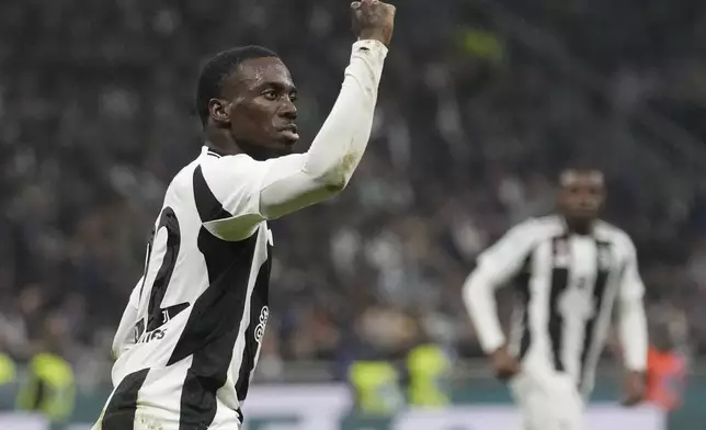 Juventus' Timothy Weah celebrates after scoring his side's second goal during a Serie A soccer match between Inter Milan and Juventus at the San Siro stadium in Milan, Italy, Sunday, Oct. 27, 2024. (AP Photo/Luca Bruno)