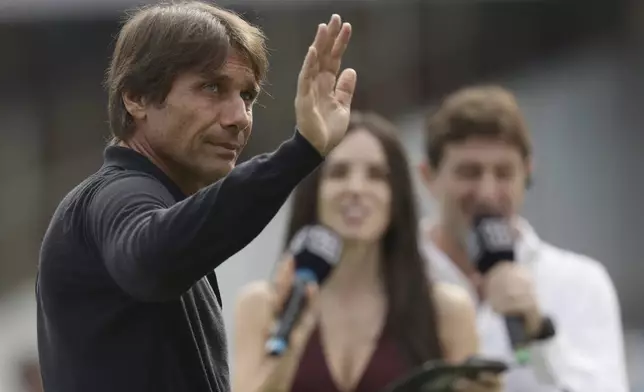 Napoli's head coach Antonio Conte gestures before the Serie A soccer match between Napoli and Lecce at the Diego Armando Maradona Stadium in Naples, Italy, Saturday, Oct. 26, 2024. (Alessandro Garofalo/LaPresse via AP)