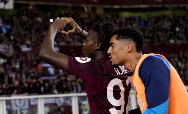 Torino's Njie celebrates after scoring their side's first goal of the game during the Serie A soccer match between Torino FC and Como at the Stadio Olimpico Grande Torino in Turin, Italy,Oct. 25, 2024. (Fabio Ferrari/LaPresse via AP)