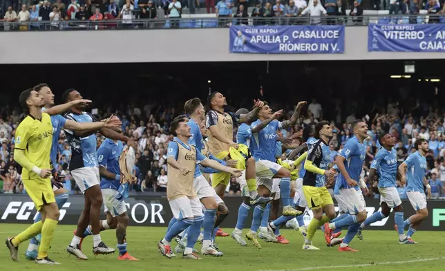 Napoli players celebrate their 1-0 win at the end of the Serie A soccer match between Napoli and Lecce at the Diego Armando Maradona Stadium in Naples, Italy, Saturday, Oct. 26, 2024. (Alessandro Garofalo/LaPresse via AP)