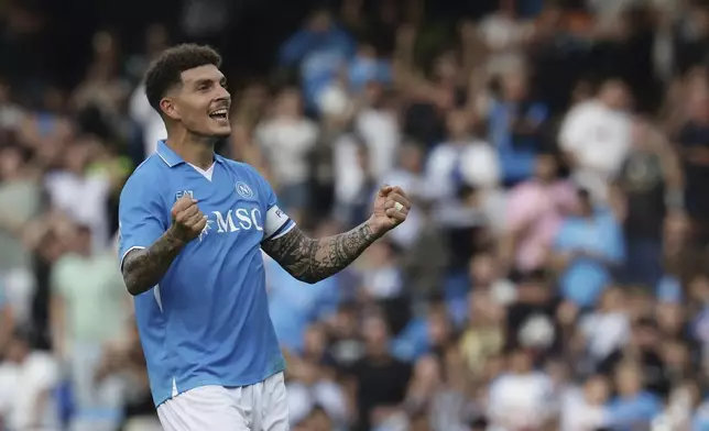 Napoli's Giovanni Di Lorenzo celebrates after scoring the opening goal during the Serie A soccer match between Napoli and Lecce at the Diego Armando Maradona Stadium in Naples, Italy, Saturday, Oct. 26, 2024. (Alessandro Garofalo/LaPresse via AP)