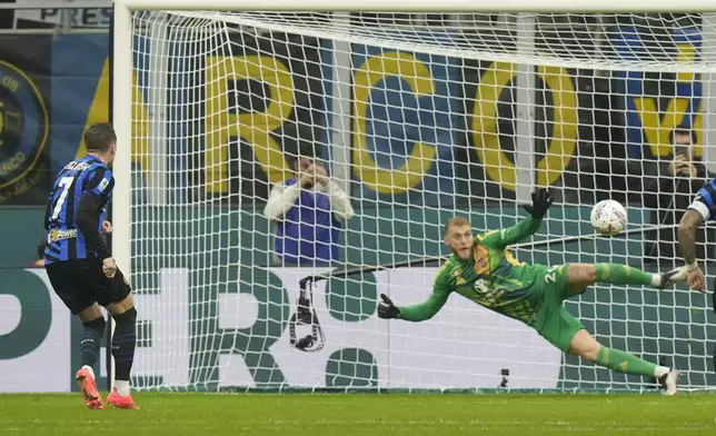 Inter Milan's Piotr Zielinski scores his side's opening goal from a penalty kick during a Serie A soccer match between Inter Milan and Juventus at the San Siro stadium in Milan, Italy, Sunday, Oct. 27, 2024. (AP Photo/Luca Bruno)