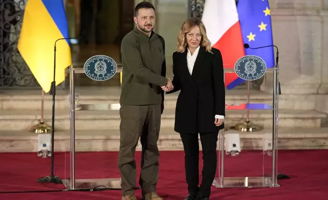 Italian Premier Giorgia Meloni, right, and Ukrainian President Volodymyr Zelenskyy pose for photographers after the press conference, at Villa Pamphilj, in Rome, Thursday, Oct. 10, 2024. (AP Photo/Andrew Medichini)