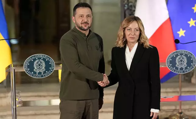 Italian Premier Giorgia Meloni, right, and Ukrainian President Volodymyr Zelenskyy pose for photographers after the press conference, at Villa Pamphilj, in Rome, Thursday, Oct. 10, 2024. (AP Photo/Andrew Medichini)