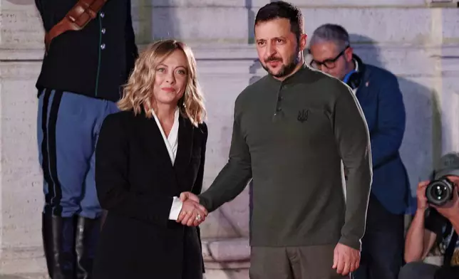 Italian Prime Minister Giorgia Meloni greets Ukrainian President Volodymyr Zelenskyy during a meeting at Rome's Villa Pamphilj, Wednesday, Oct. 10, 2024. (Roberto Monaldo/LaPresse via AP)