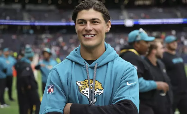 Jacksonville Jaguars wide receiver Louis Rees-Zammit (84), who is part of the practice squad, poses for a photo before an NFL football game at the Tottenham Hotspur stadium between the Jacksonville Jaguars and Chicago Bears in London, Sunday, Oct. 13, 2024. (AP Photo/Ian Walton)