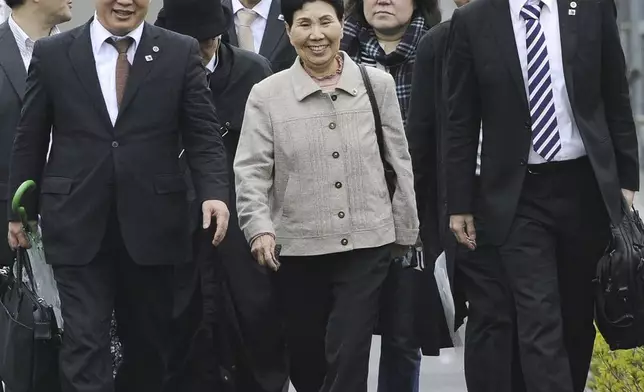 Hideko Hakamada, center, sister of former boxer Iwao Hakamada who has been on death row for a 1966 quadruple murder case, visits Tokyo Detention Center in Tokyo after a court ordered a retrial for her brother, on March 27, 2014. Japanese prosecutors said on Oct. 8, 2024 they will not appeal the Sept. 26 ruling of the Shizuoka District Court that acquitted the world’s longest-serving death-row inmate in a retrial. (Kyodo News via AP)