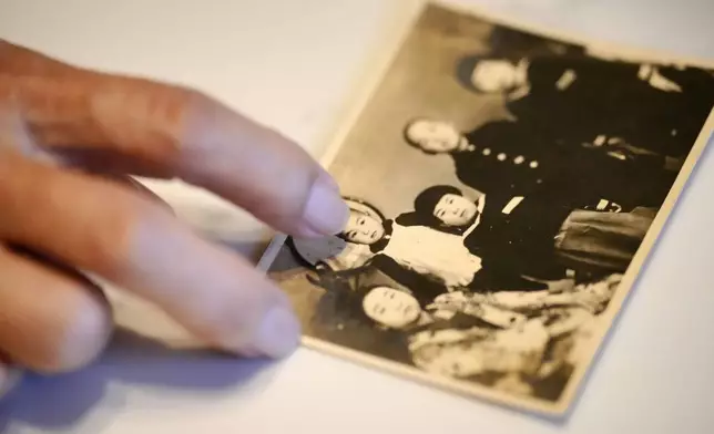 Hideko Hakamada, sister of Iwao Hakamada, shows a family photo during an interview with The Associated Press in Hamamatsu, Shizuoka prefecture, central Japan, Thursday, Oct. 17, 2024. (AP Photo/Eugene Hoshiko)