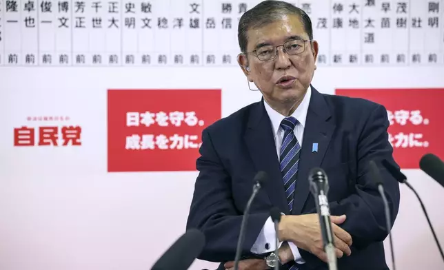 Japan's Prime Minister and president of the Liberal Democratic Party (LDP) Shigeru Ishiba speaks to the media regarding the early result of lower house election, at the LDP headquarters Sunday, Oct. 27, 2024 in Tokyo, (Takashi Aoyama/Pool Photo via AP)