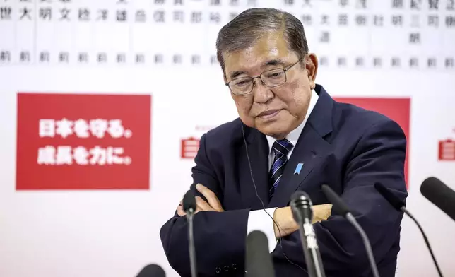 Japan's Prime Minister and president of the Liberal Democratic Party (LDP) Shigeru Ishiba speaks to the media regarding the early result of lower house election, at the LDP headquarters Sunday, Oct. 27, 2024 in Tokyo, (Takashi Aoyama/Pool Photo via AP)