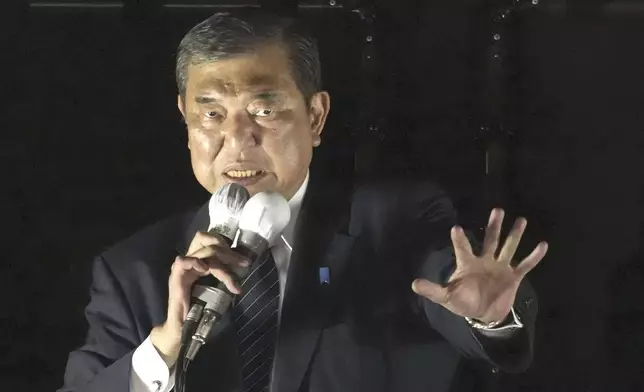 Japan's Prime Minister and head of the governing Liberal Democratic Party Shigeru Ishiba speaks during a campaigning for a parliamentary election in Tokyo, Japan, Saturday, Oct. 26, 2024. (Kyodo News via AP)