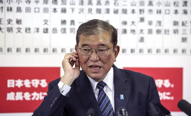 Japan's Prime Minister and president of the Liberal Democratic Party (LDP) Shigeru Ishiba speaks to the media regarding the lower house election, at the LDP headquarters Sunday, Oct. 27, 2024 in Tokyo, (Takashi Aoyama/Pool Photo via AP)