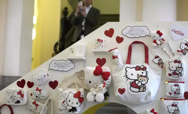 A visitor looks at Hello Kitty display at the exhibition "As I change, so does she," marking the 50th anniversary of Hello Kitty at the Tokyo National Museum in Tokyo Wednesday, Oct. 30, 2024. (AP Photo/Shuji Kajiyama)