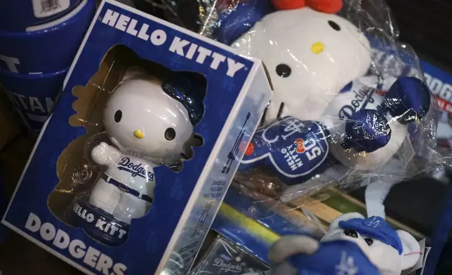 The 50th anniversary Hello Kitty dolls with Los Angeles Dodgers uniform are sold at a shop Wednesday, Oct. 23, 2024 in Tokyo. (AP Photo/Eugene Hoshiko)