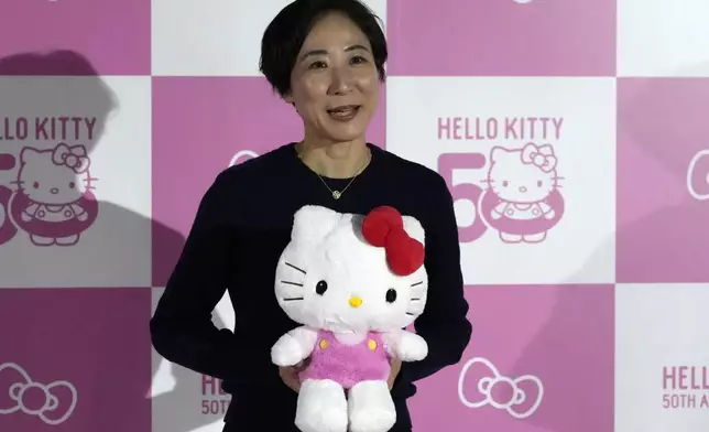 Yuko Akiyama, one of the directors at Sanrio, speaks to the media during the exhibition "As I change, so does she," marking the 50th anniversary of Hello Kitty at the Tokyo National Museum in Tokyo Wednesday, Oct. 30, 2024. (AP Photo/Shuji Kajiyama)