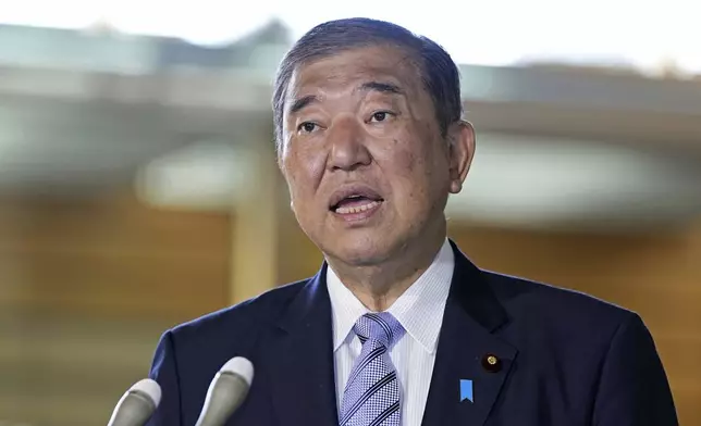 Japan's Prime Minister Shigeru Ishiba speaks to the journalists after a report of North Korea's missile launch, at his office in Tokyo Thursday, Oct. 31, 2024. (Kyodo News via AP)